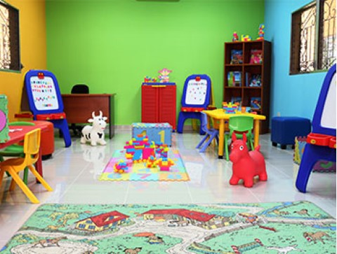 Children International provides safe places for children to learn and play, like this play area at a community center in Honduras.