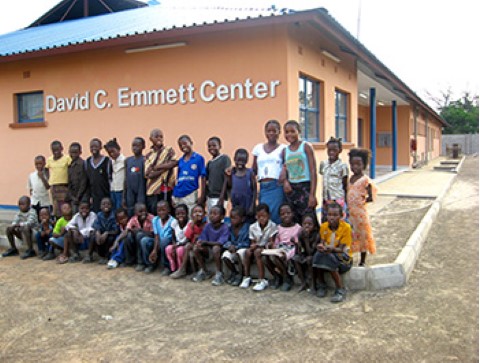 a group of people standing in front of a building