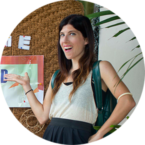 a woman is standing in front of a sign