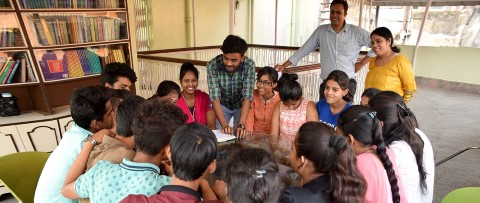 a group of people sitting around a table