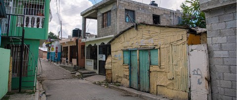 a street with a building and a clock on it