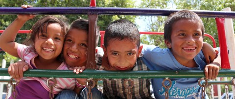 a group of children playing on a playground