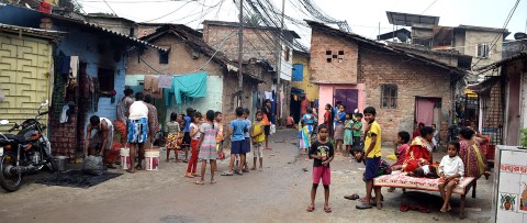 a group of people standing around a street