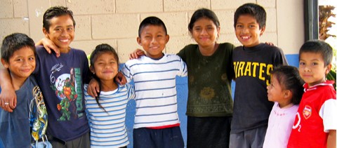 a group of children standing next to each other