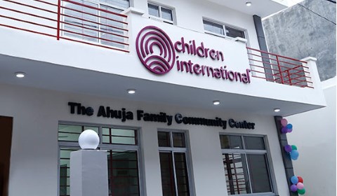 a building with a sign that says Children International