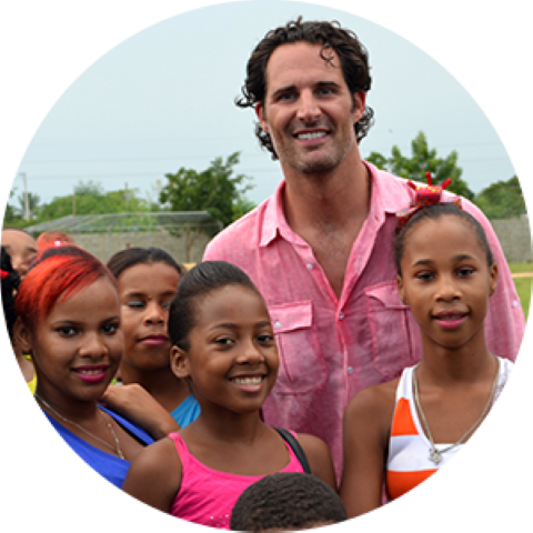 a man standing in front of a group of children