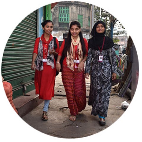 a group of women walking down a street