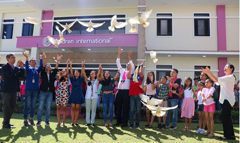 a group of people standing in front of a building