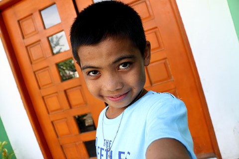 Rein stands in front of a doorway for his selfie.  