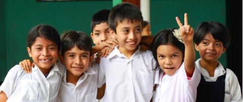 a group of children standing next to each other