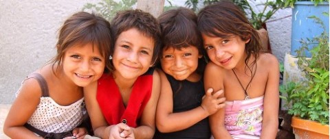 a group of young girls sitting next to each other