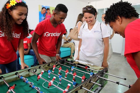 Susana referees a foosball game