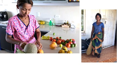 a woman standing in a kitchen next to a counter