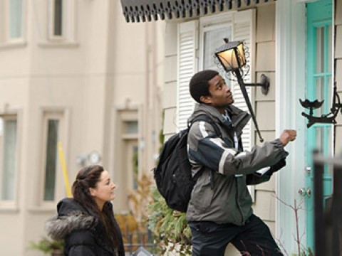 a man and a woman knocking on a house door