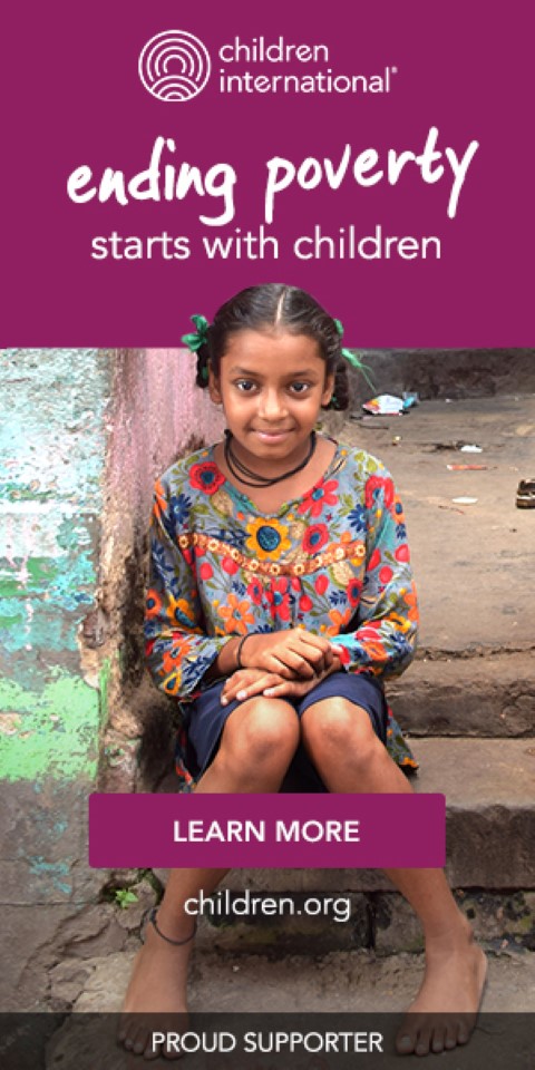 a young girl sitting on the steps of a building