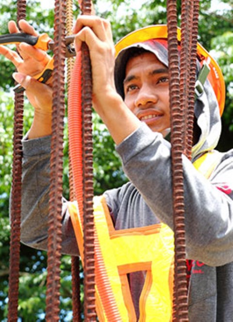 In the Philippines, Jomarie is a building wire technician. He brings in $240 per month.