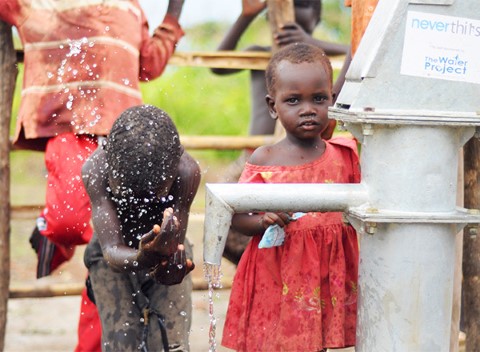Kids in South Sudan using the water well