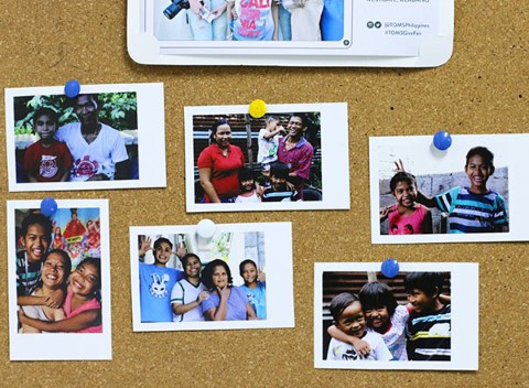 Pauline posted her favorite photos to a bulletin board.