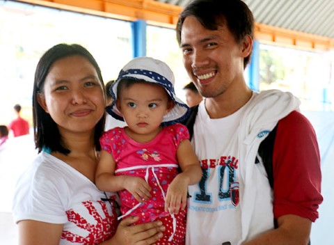 Two of Jed’s sponsors, Ruth and Archie, proudly hold their adorable daughter.