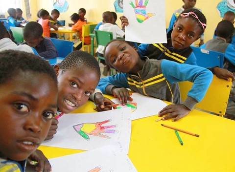 Zambian kids in the Early Childhood Development program take selfies