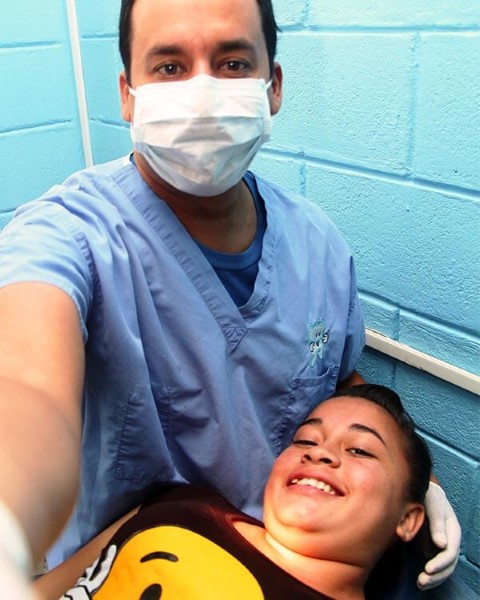 Javier takes a selfie with a patient 