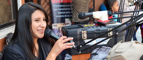 A girl in CI’s Community Youth Reporter program in Ecuador prepares for a radio broadcast