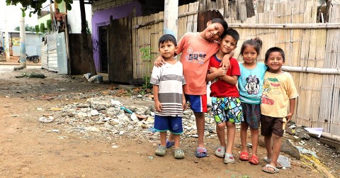 a group of children standing next to each other