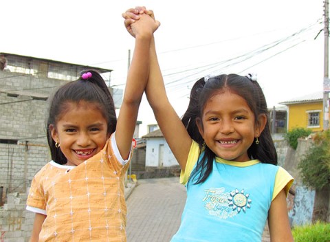 Girls in Quito hold hands