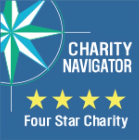 Un cartel azul y blanco que dice Charity Navigator Four Star