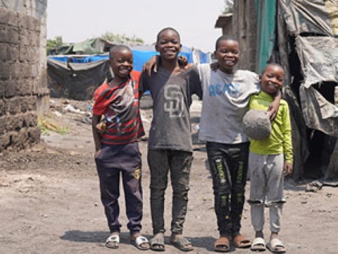 a group of children standing next to each other