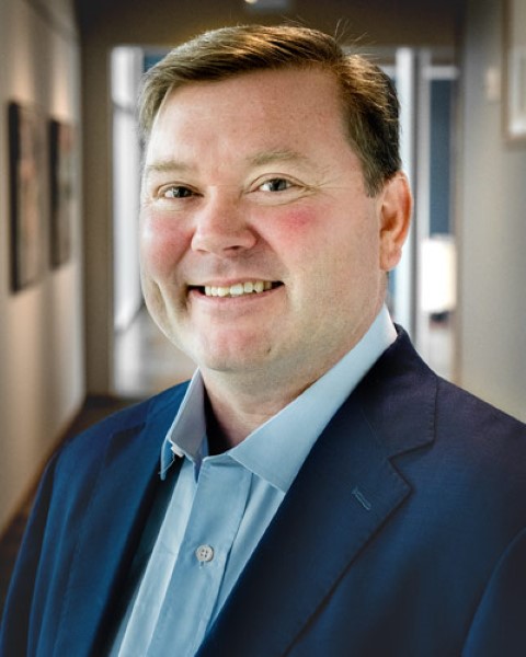 man smiling in a sports coat