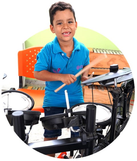 a boy playing drums