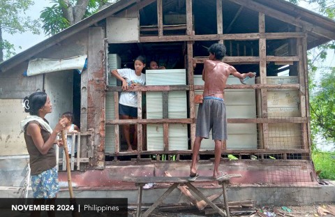 Family works together to repair their home