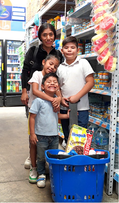 a family buying food supplies in a supermarket