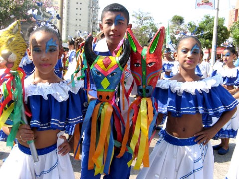 three children dress up for the carnival