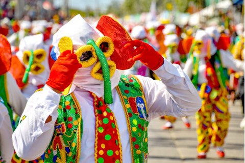 a person dressed with a colorful mask for the carnival
