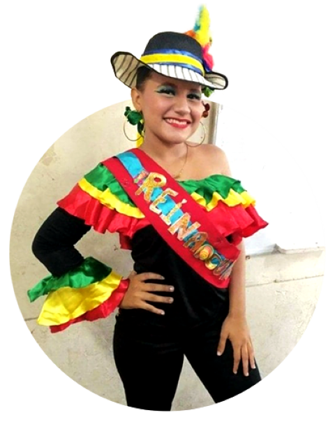 a teen dressed in traditional costume smiling at the camera