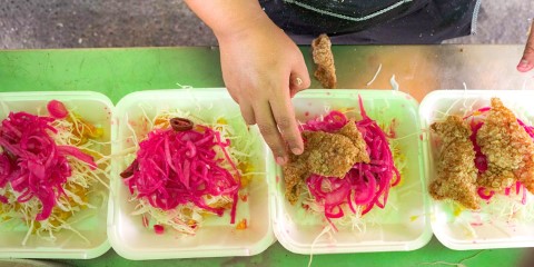 Containers with pieces of fried pork