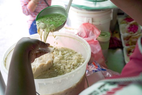 horchata being poured into a plastic bag