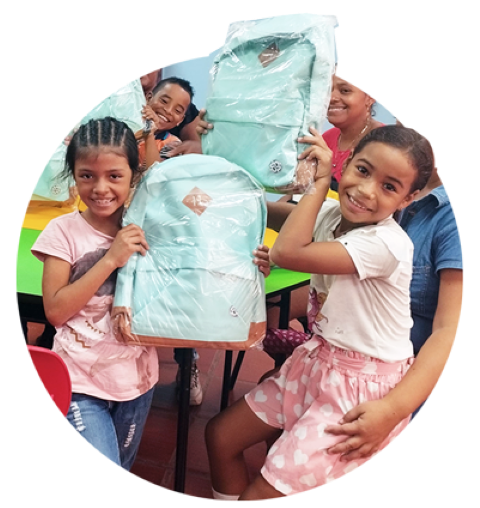 a group of children with new backpacks